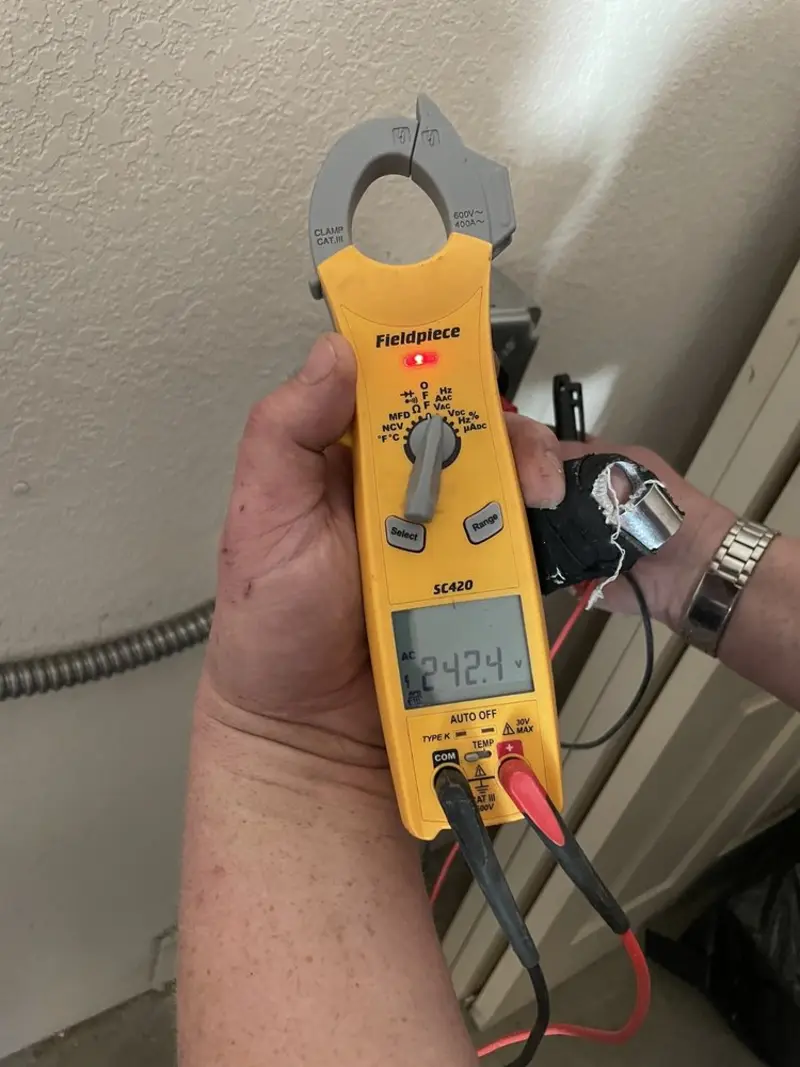 Voltage testing with clamp meter during Generator Installation in Portola Valley